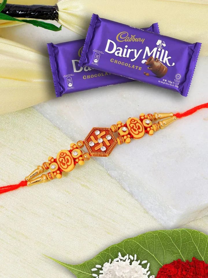 Swastika Gold Rakhi & Choco Hamper: Festive Drama Gift